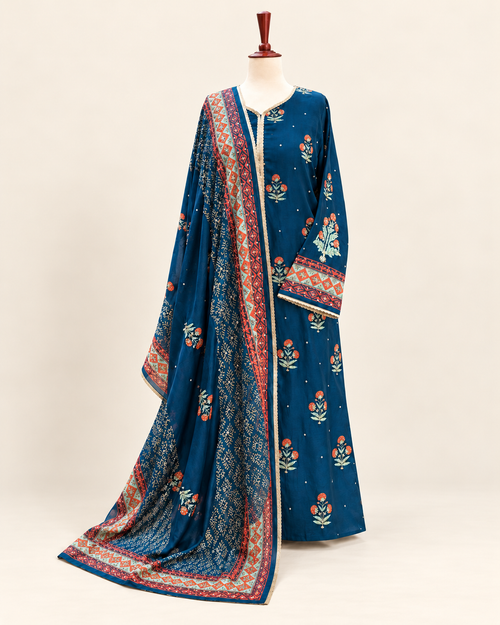 Blue floral three-piece suit with coral and mint borders and matching printed dupatta, shown in full